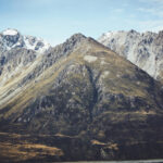 A mountain range with a lake in the background.
