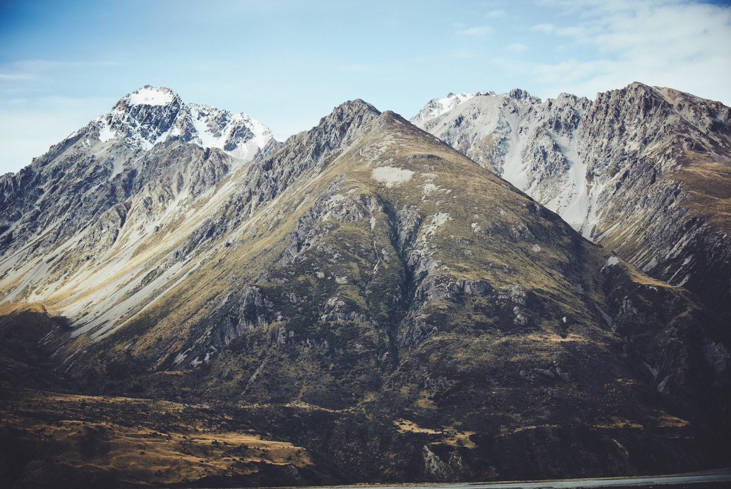 A mountain range with a lake in the background.